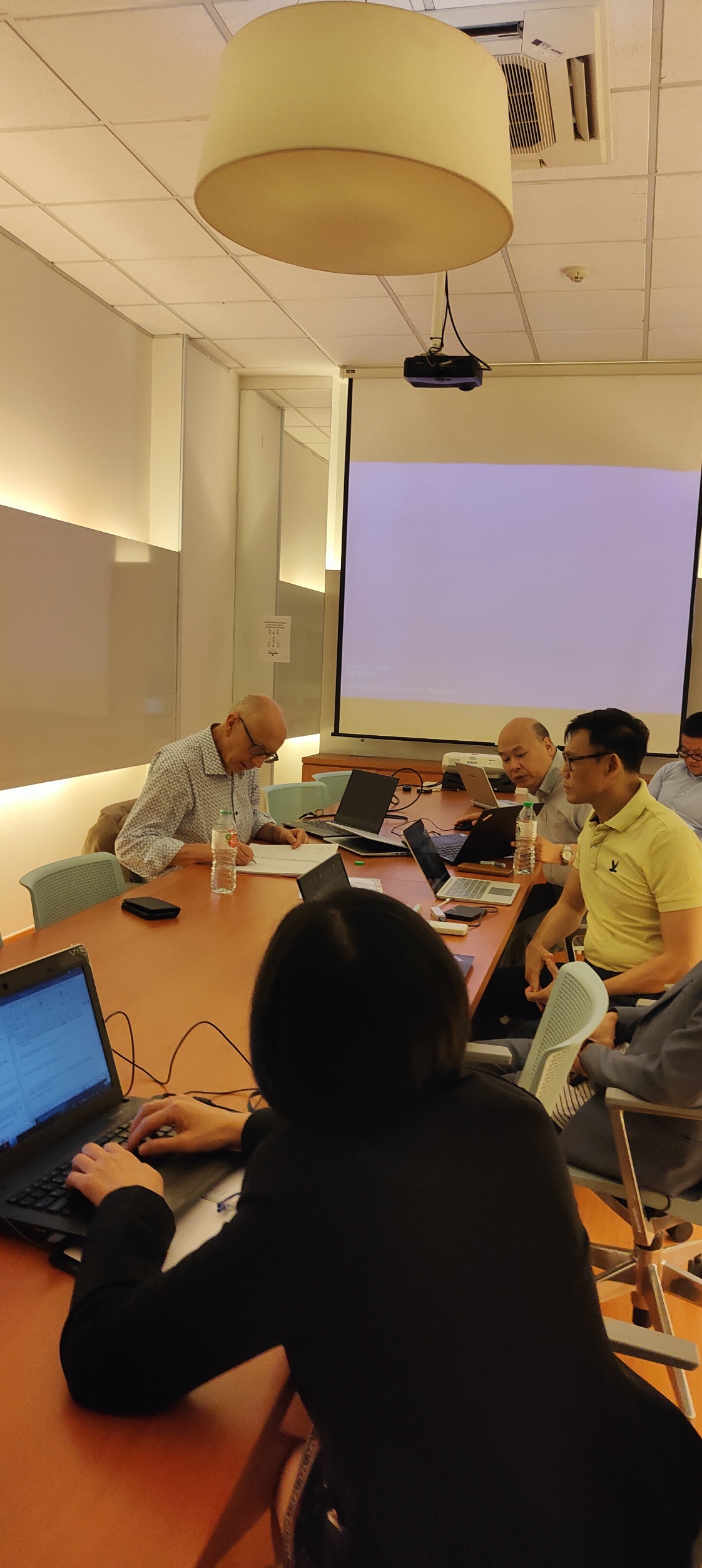 Dr. Alan Go — in discussion with university partner